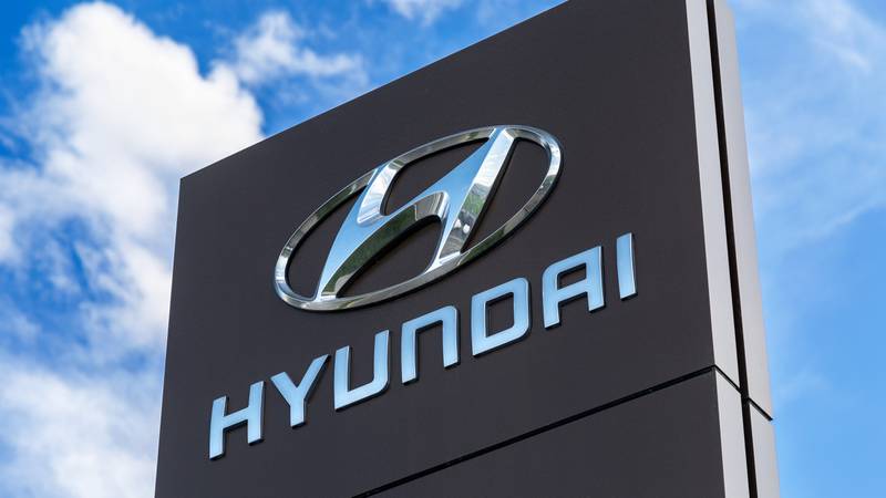 Hyundai sign against a blue, cloudy sky